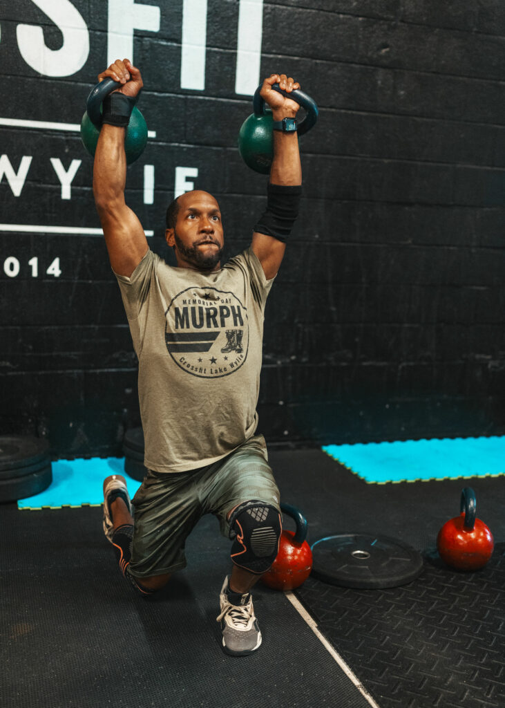 Picture of Justin Frazier holding two kettle bells