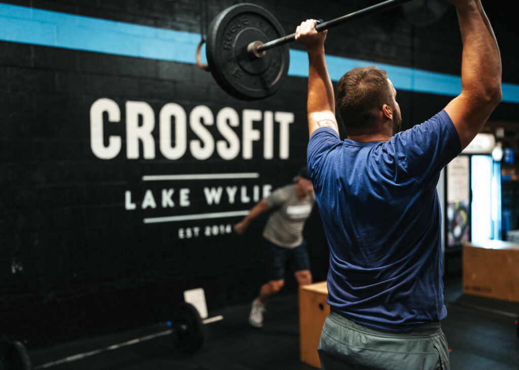 Picture of athlete with a barbell overhead